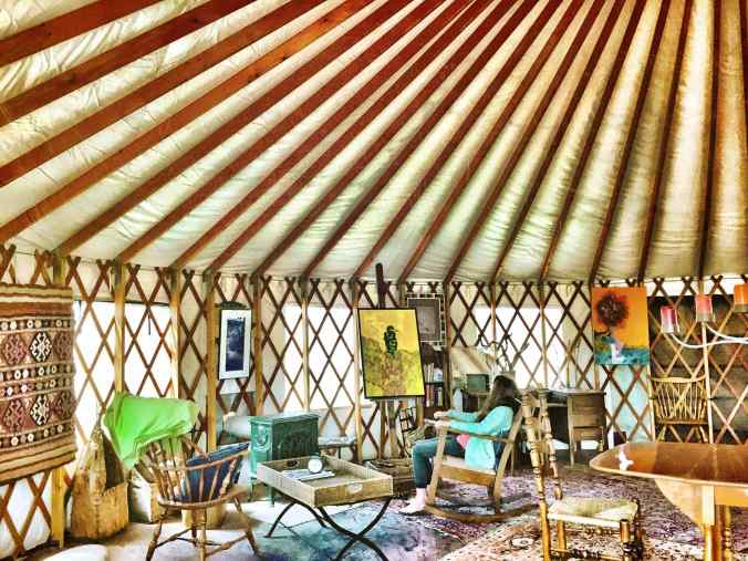sitting in glamping yurt